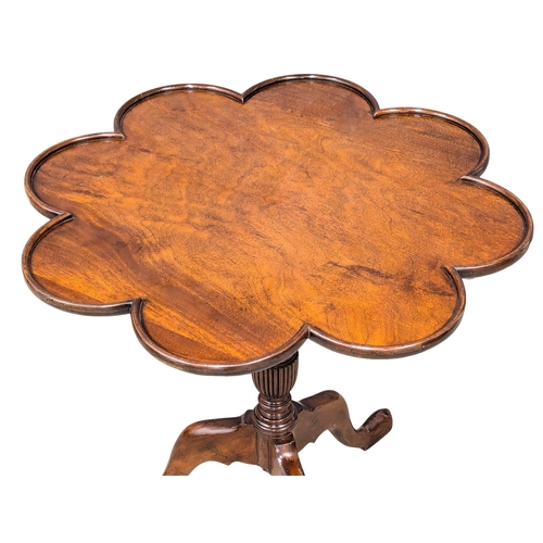 262 - An Early - Mid 20th Century revolving mahogany pedestal tilt top lamp table. 68x68cm (3)