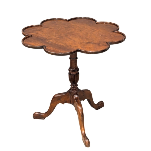 262 - An Early - Mid 20th Century revolving mahogany pedestal tilt top lamp table. 68x68cm (3)