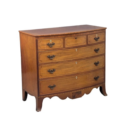 273 - A George III inlaid mahogany bow front chest of drawers on splayed bracket feet. 118x60x104.5cm (5)