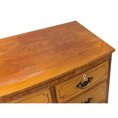 273 - A George III inlaid mahogany bow front chest of drawers on splayed bracket feet. 118x60x104.5cm (5)