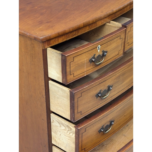 273 - A George III inlaid mahogany bow front chest of drawers on splayed bracket feet. 118x60x104.5cm (5)