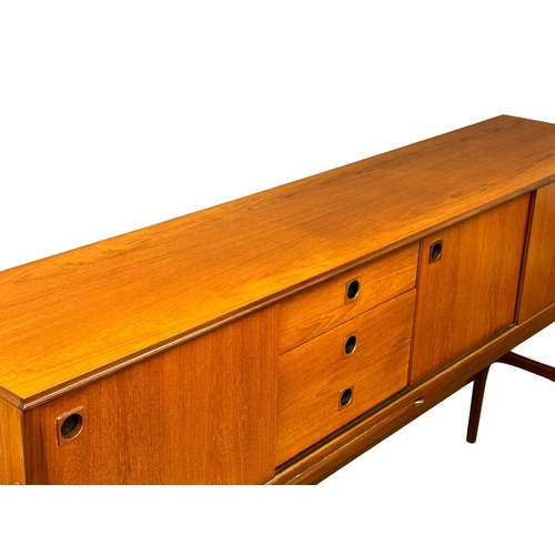 35 - Elliots of Newbury. A Mid Century teak credenza sideboard dinning room set. With 4 chairs and drop l... 