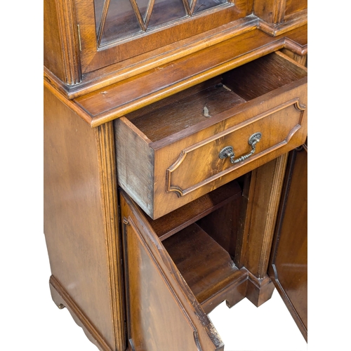 423 - A George III style mahogany breakfront bookcase with astragal glazed doors. 192x42x197cm (2)