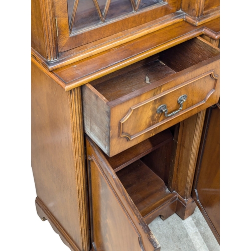 423 - A George III style mahogany breakfront bookcase with astragal glazed doors. 192x42x197cm (2)