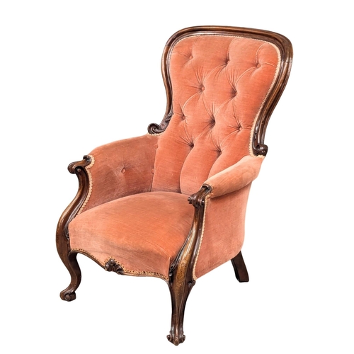 531A - A 19th Century Victorian mahogany spoon back armchair on Cabriole legs. Circa 1860s. (9)