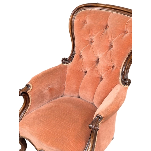 531A - A 19th Century Victorian mahogany spoon back armchair on Cabriole legs. Circa 1860s. (9)