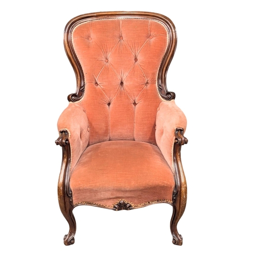 531A - A 19th Century Victorian mahogany spoon back armchair on Cabriole legs. Circa 1860s. (9)