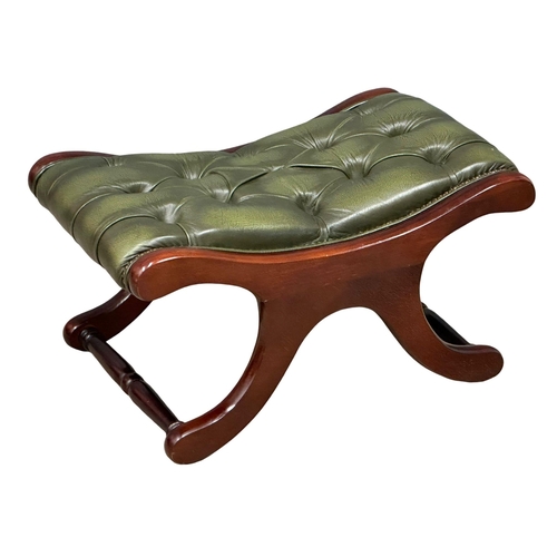 435 - A deep button leather, mahogany framed footstool. (5)