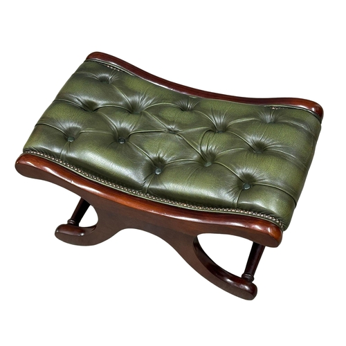 435 - A deep button leather, mahogany framed footstool. (5)