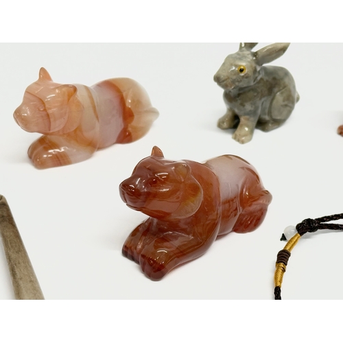 295 - A collection of Chinese polished stone miniatures and a jade necklace.