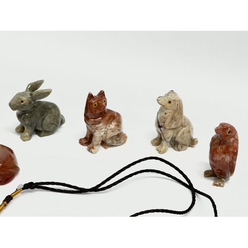 295 - A collection of Chinese polished stone miniatures and a jade necklace.