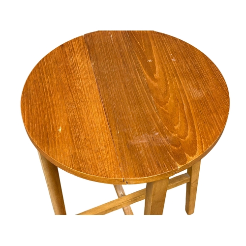 503 - A Danish Mid century teak nest of tables designed by Poul Hundevad. Circa 1960. (1)