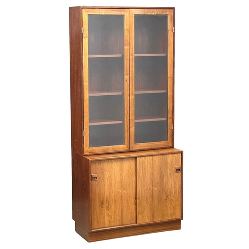 51 - A Danish Mid Century rosewood bookcase. By Dyrlund. 86x42x191cm. 5