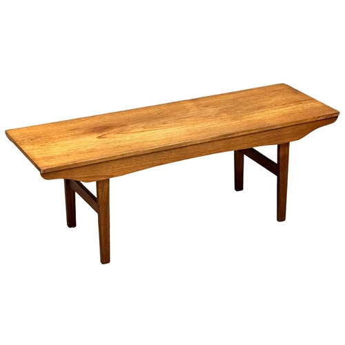 514 - A Mid Century teak coffee table. 121.5x40x43.5cm. 1