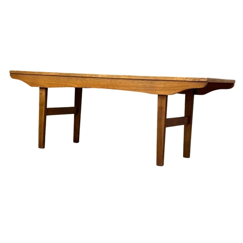 514 - A Mid Century teak coffee table. 121.5x40x43.5cm. 1