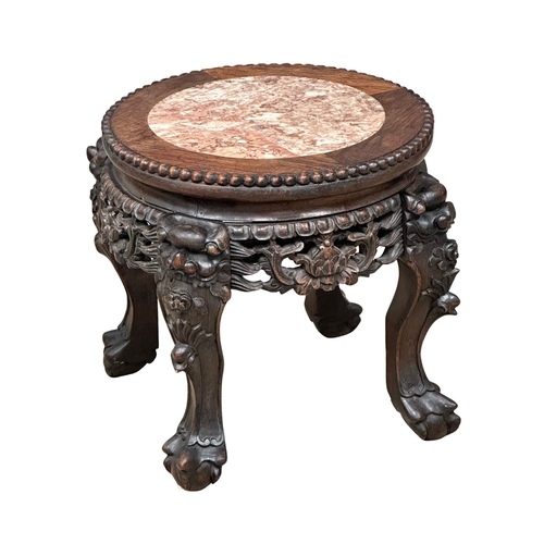 515 - A small Late 19th Century carved padauk plantstand, with marble top. 38x31.5cm. 1