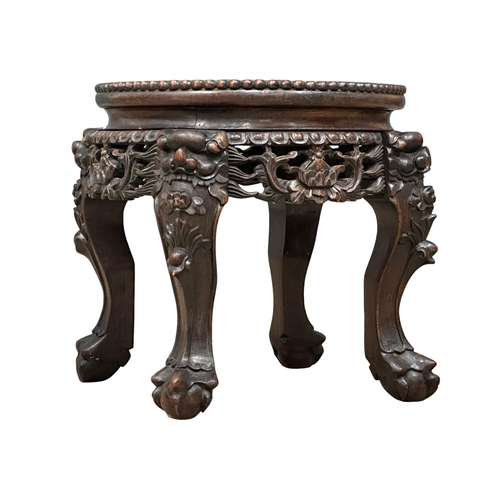 515 - A small Late 19th Century carved padauk plantstand, with marble top. 38x31.5cm. 1