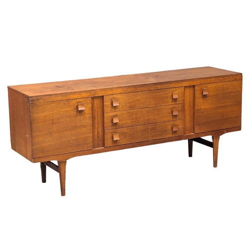 521A - A Mid Century teak sideboard by Elliots of Newbury. 172.5x44x72.5cm. 7