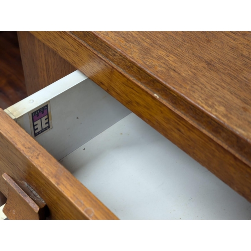 521A - A Mid Century teak sideboard by Elliots of Newbury. 172.5x44x72.5cm. 7