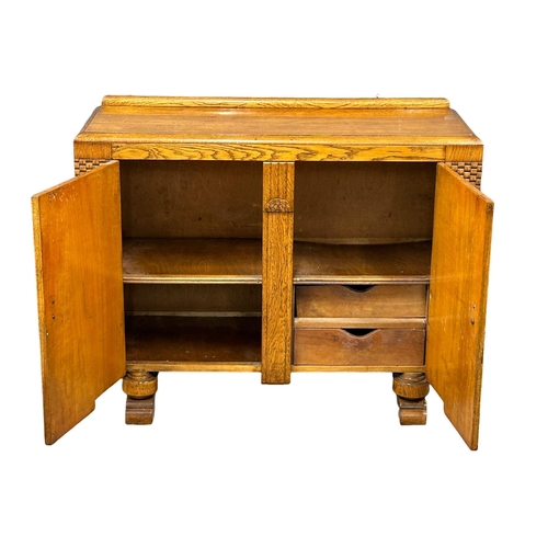 533 - A 1930’s Art Deco oak sideboard. 122x47x96cm (1)