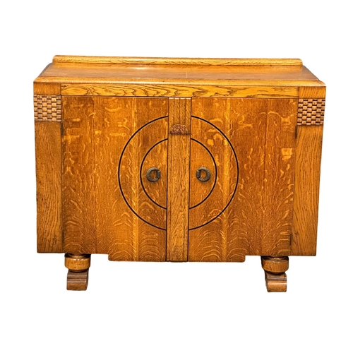 533 - A 1930’s Art Deco oak sideboard. 122x47x96cm (1)