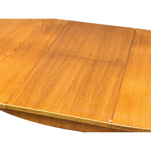 534 - A G-Plan Mid Century teak extending dining table. 185x101x73cm  (4)