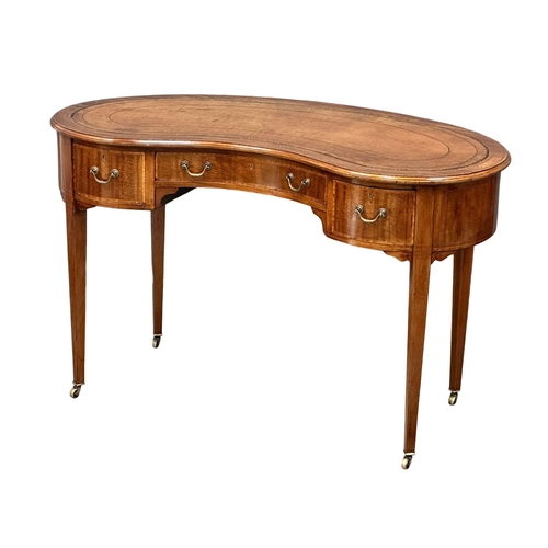 541 - A Late 19th Century Sheraton Revival inlaid mahogany kidney shaped writing desk, with leather top. C... 