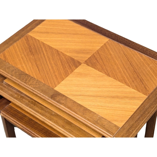 554 - A Danish Mid Century teak nest of tables. 6