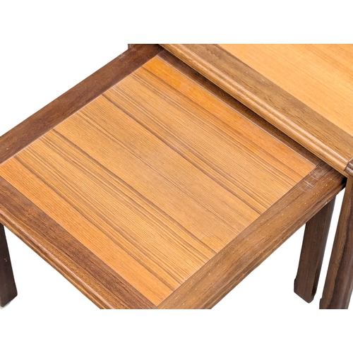 554 - A Danish Mid Century teak nest of tables. 6