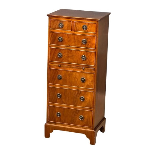 555 - A Georgian style mahogany tallboy chest of drawers, with brushing slide and bracket feet. 48.5x40x11... 