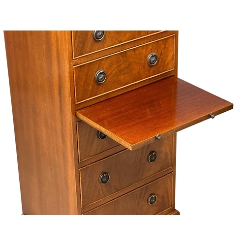 555 - A Georgian style mahogany tallboy chest of drawers, with brushing slide and bracket feet. 48.5x40x11... 