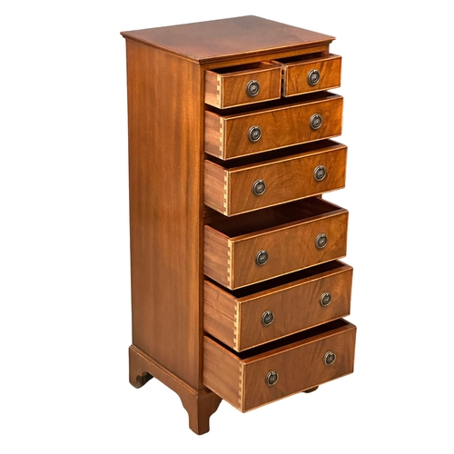 555 - A Georgian style mahogany tallboy chest of drawers, with brushing slide and bracket feet. 48.5x40x11... 