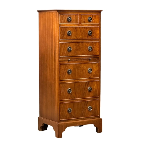 555 - A Georgian style mahogany tallboy chest of drawers, with brushing slide and bracket feet. 48.5x40x11... 