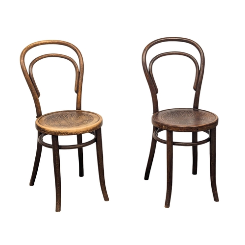 566 - A pair of Early 20th Century Bentwood chairs. By Johann Kohn. (7)