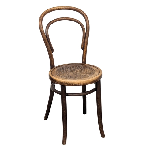 566 - A pair of Early 20th Century Bentwood chairs. By Johann Kohn. (7)