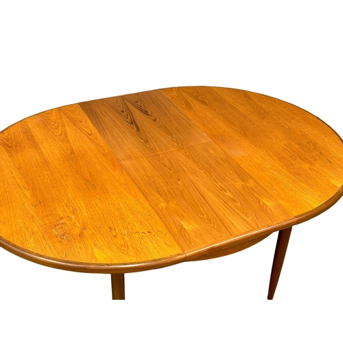 57 - A G-Plan “Fresco” Mid Century teak extending dining table and 4 chairs. Designed by Victor Wilkins. ... 