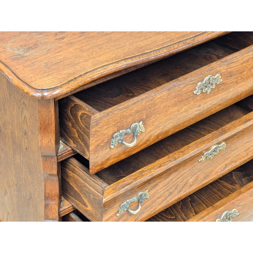 575 - A North European 18th Century style oak chest of drawers. 74x40x64cm (11)