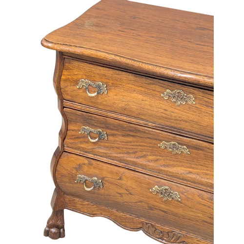 575 - A North European 18th Century style oak chest of drawers. 74x40x64cm (11)