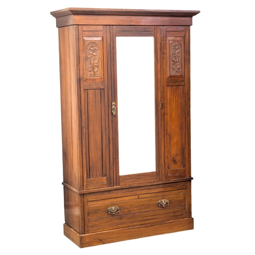 581 - A late 19th Century Victorian walnut wardrobe. Circa 1890-1900. 123x49x203cm. 3