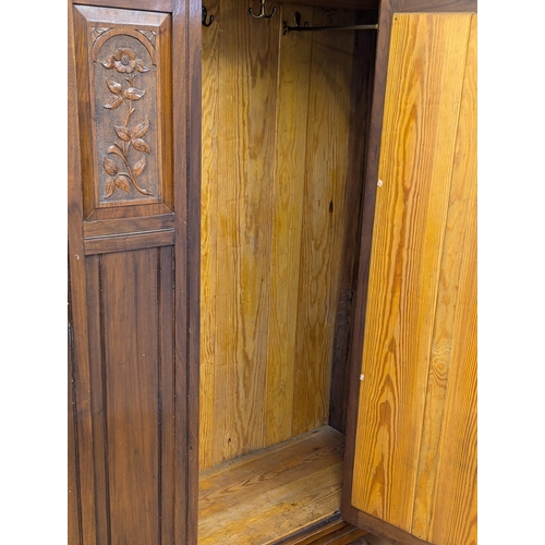 581 - A late 19th Century Victorian walnut wardrobe. Circa 1890-1900. 123x49x203cm. 3