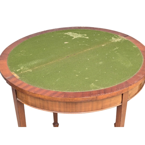 583 - An Early 20th Century Georgian style mahogany demi-lune turnover games table. 85x42x79cm (3)