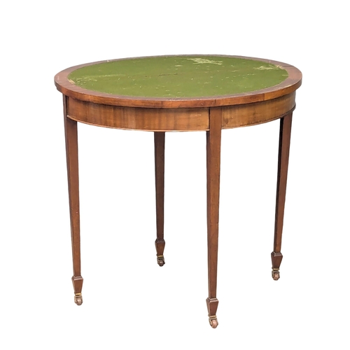 583 - An Early 20th Century Georgian style mahogany demi-lune turnover games table. 85x42x79cm (3)