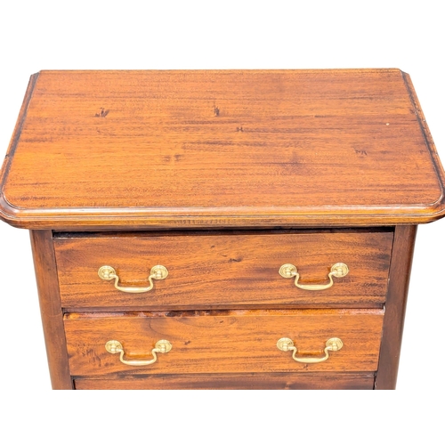 593 - A 19th Century style mahogany chest of drawers with brass drop handles on Cabriole legs. 67x44x69cm ... 