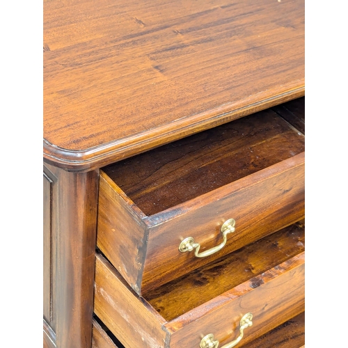 593 - A 19th Century style mahogany chest of drawers with brass drop handles on Cabriole legs. 67x44x69cm ... 