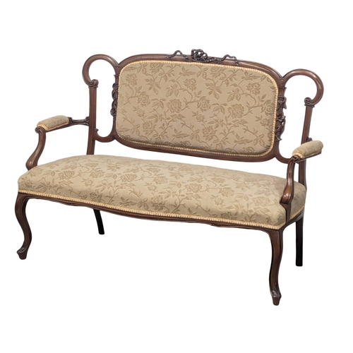 595A - An Edward VII mahogany sofa. Edwardian, Circa 1901-1910. 130cm. 8