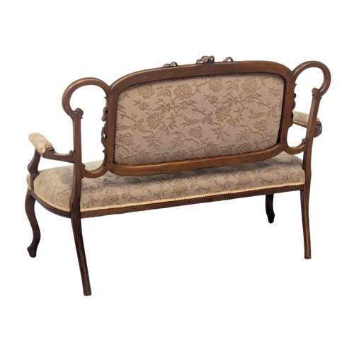 595A - An Edward VII mahogany sofa. Edwardian, Circa 1901-1910. 130cm. 8