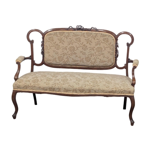 595A - An Edward VII mahogany sofa. Edwardian, Circa 1901-1910. 130cm. 8