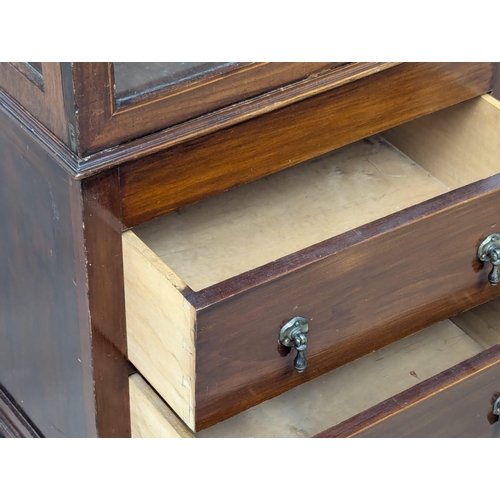 641 - An Early 20th Century mahogany display cabinet with 2 drawers. 60x36x158cm. 5