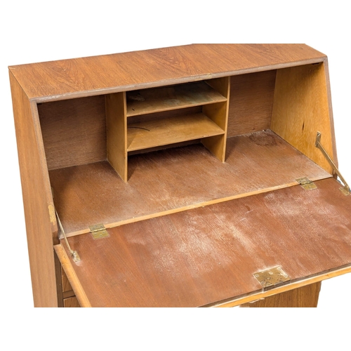 642 - A Mid Century teak bureau. 73.5x32x99cm. 1