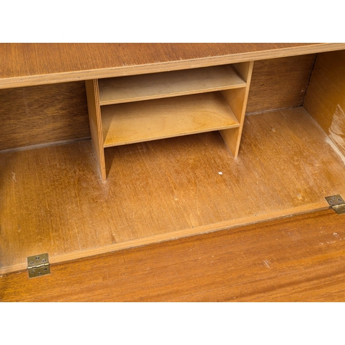 643 - A Mid Century teak bureau. 73.5x32x99cm. 1